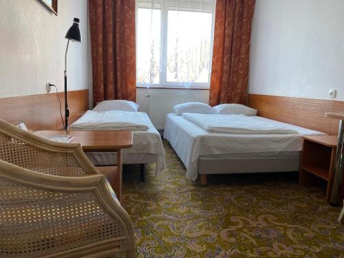 Łóżko lub łóżka w pokoju w obiekcie Hotel Górecki