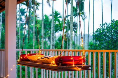 a group of bags sitting on a swing at Zostel Homes Wayanad (Karapuzha) in Wayanad