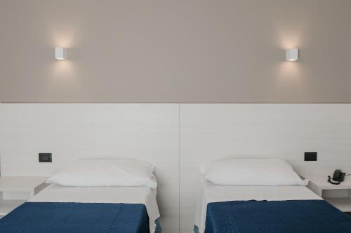 Una cama o camas en una habitación de Residence Vazzieri