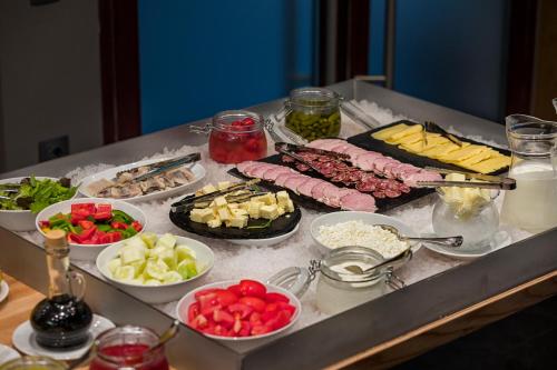 a buffet with different types of food on a table at Yaremche Club Hotel in Yaremche