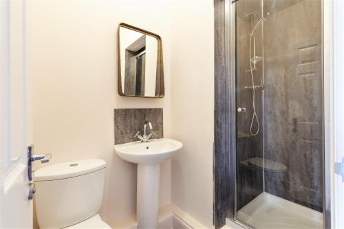 a bathroom with a toilet and a sink and a shower at Clifton House I Free Private Parking in Bristol