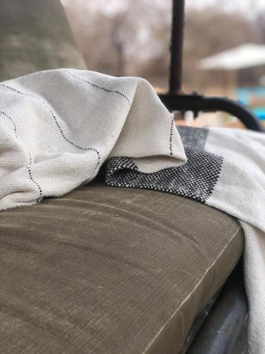 a blanket sitting on top of a couch at Simba Safaris African Pride Exotic Lodge in Lephalale