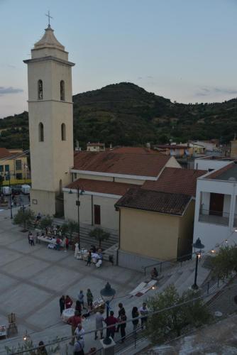 a group of people standing in front of a church at B&B Rita and Family in Loceri