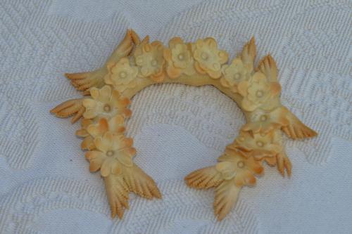 a star shaped object with flowers on a white blanket at B&B Rita and Family in Loceri