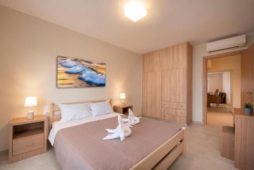 Ένα ή περισσότερα κρεβάτια σε δωμάτιο στο KOS VILLAS AND APPARTMENTS