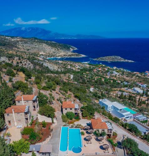 an aerial view of a resort with a pool at Strofilia Authentic Villas in Skinária