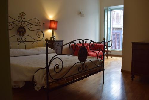 Кровать или кровати в номере Appartamento Vannucci 10