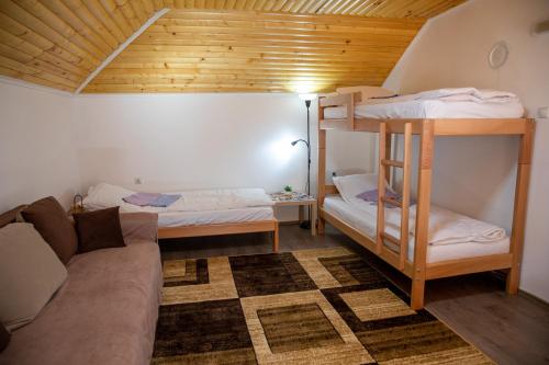 a living room with two bunk beds and a couch at Kuca Stojanovica Topli Do in Pirot