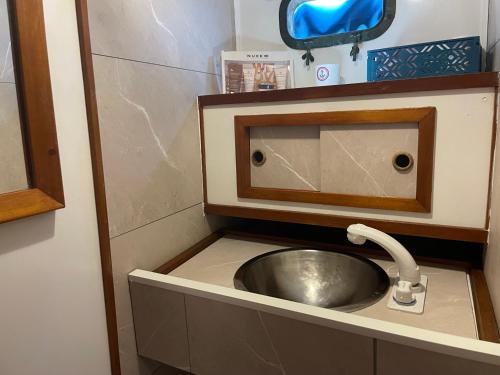 a sink in a small bathroom with a sink at Monte-Carlo for boat lovers in Monte Carlo