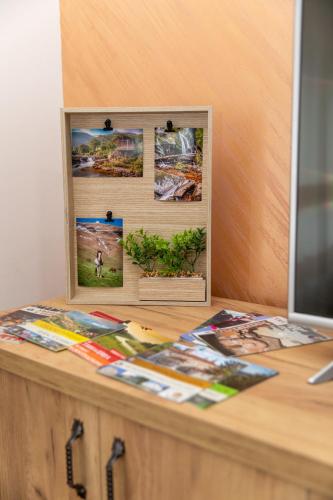 a desk with a picture frame on top of it at Kuca Stojanovica Topli Do in Pirot