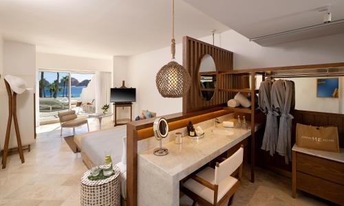 a living room with a bed and a couch at ME Cabo by Meliá in Cabo San Lucas