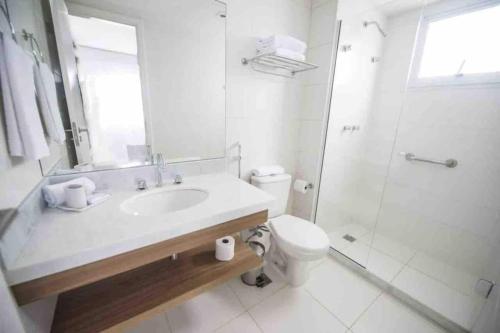 a bathroom with a sink and a toilet and a shower at Rio Stay in Rio de Janeiro
