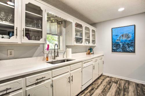 a kitchen with white cabinets and a sink at Cedar Creek Lake Home Private Dock and Hot Tub in Gun Barrel City