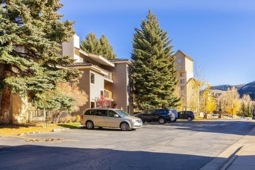 a car parked in a parking lot next to a building at Beaver Creek West S2 1 Bedroom condo in Avon