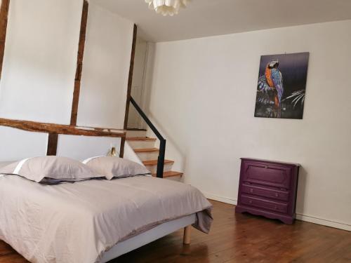 Postel nebo postele na pokoji v ubytování Lectoure centre Historique