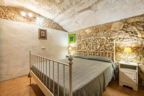 Säng eller sängar i ett rum på Can Cirera, casa rural