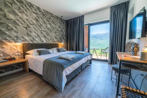 Postel nebo postele na pokoji v ubytování ARGENTO RESIDENCE