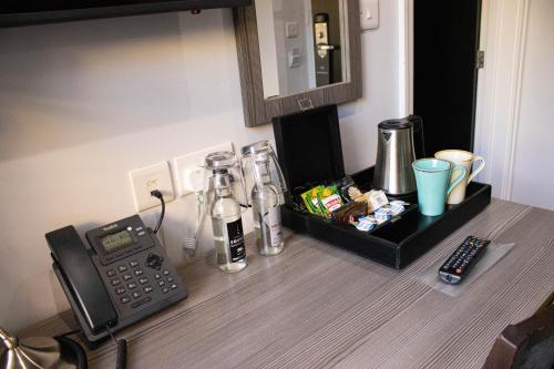 a kitchen counter with a phone and a blender on it at Belmont Llandudno in Llandudno
