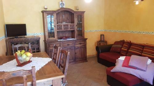 a living room with a couch and a table at Casa Vacanze SoleLuna in Montichiari