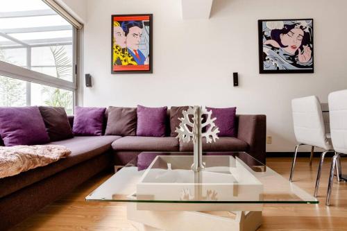 a living room with a couch and a coffee table at Beautiful apartment in Polanco area with amenities in Mexico City