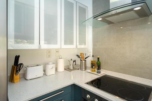 a kitchen with a counter top with a sink at Casa Vistamar in Altea
