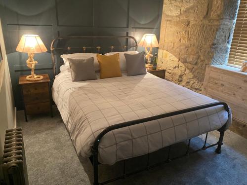 Ένα ή περισσότερα κρεβάτια σε δωμάτιο στο The Wynd Cottage