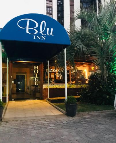 a blue awning over the entrance to a restaurant at Blu Inn in Punta del Este