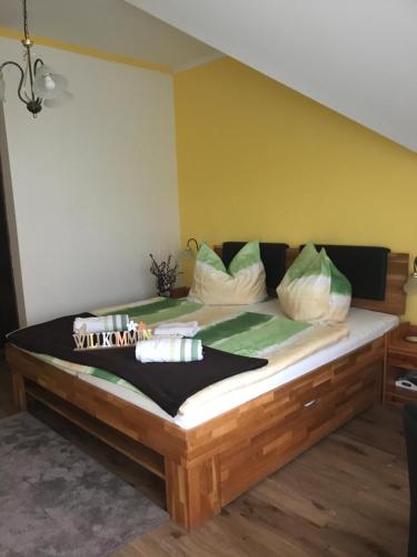 a large bed in a room with at Majláth Vendégház in Bük
