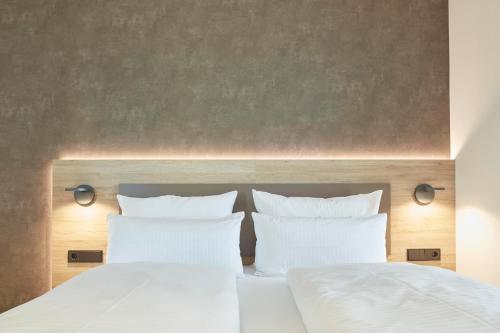 Una cama o camas en una habitación de Gästehaus Bauer - Schlafen auf dem Weingut