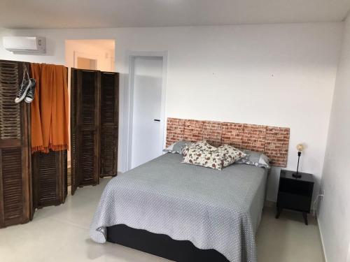 A bed or beds in a room at RESIDENCIAL Montevideo