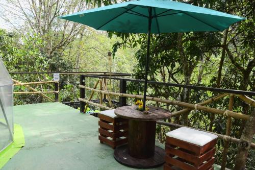 Un balcón o terraza de Glamping Dimensión Ecológica