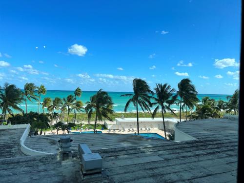 a view of the beach from the balcony of a resort at Ocean Front Units at Miami Beach in Miami Beach