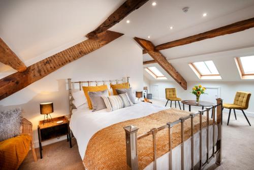 a bedroom with a large bed in a attic at Luxury Studio Apartment - Town Centre in Whitehaven