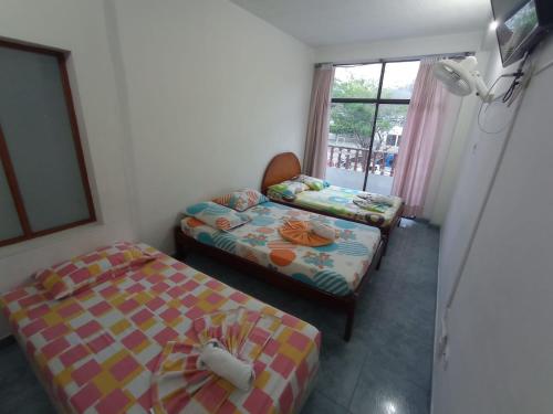 Postel nebo postele na pokoji v ubytování HOTEL LA FONTANA