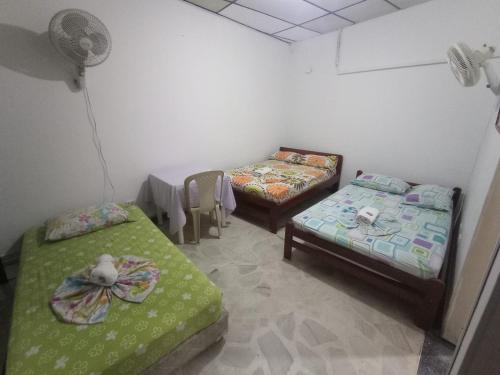 Postel nebo postele na pokoji v ubytování HOTEL LA FONTANA