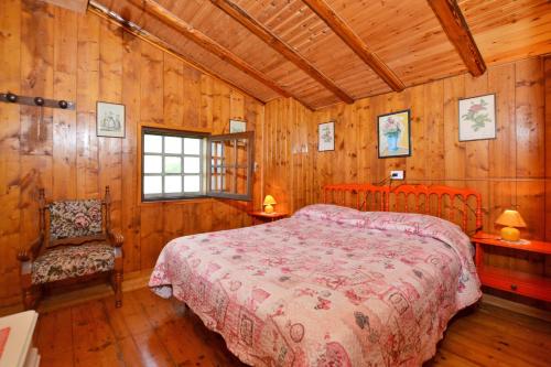 Casa Busso tesisinde bir odada yatak veya yataklar