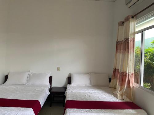 Giường trong phòng chung tại Thien Phu Nghia 1 - Homestay
