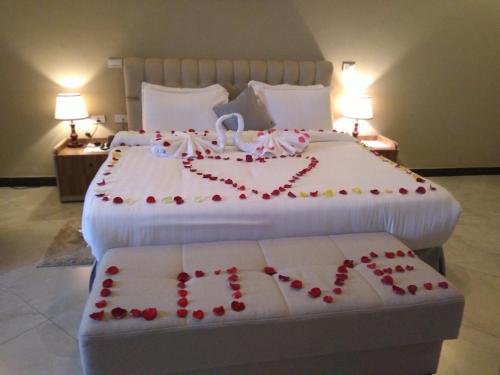 a bedroom with two beds with hearts on them at Daisy Hotel in Addis Ababa