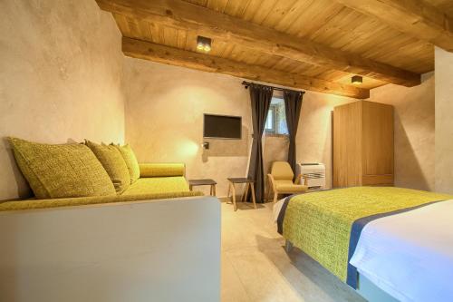 a bedroom with a bed and a tv in a room at Luxury Jerini Estate in Krk