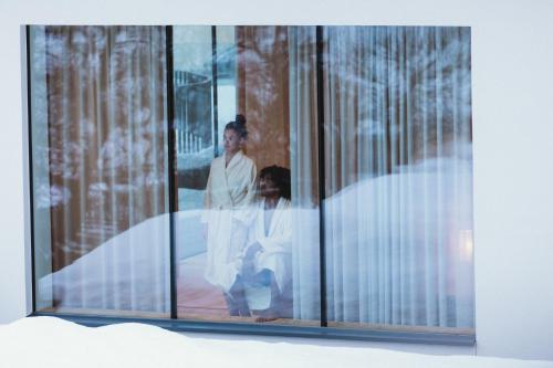 two women are standing in a glass case at Gartenhotel Linde 4 Sterne Superior in Ried im Oberinntal