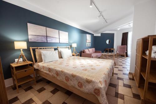 Ένα ή περισσότερα κρεβάτια σε δωμάτιο στο Apart-Hotel Safir