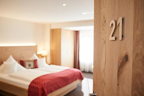 Ένα ή περισσότερα κρεβάτια σε δωμάτιο στο Landhotel Mohren