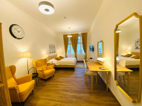 a room with two beds and a mirror at Unesco Prague Apartments in Prague