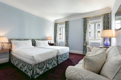 
Ein Bett oder Betten in einem Zimmer der Unterkunft Grand Hotel Duchi d'Aosta
