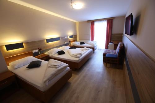 Кровать или кровати в номере Hotel Zagi