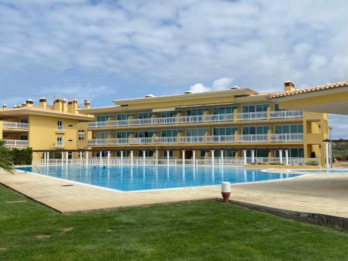 a large building with a large swimming pool at Santa Lovers in Santa Cruz