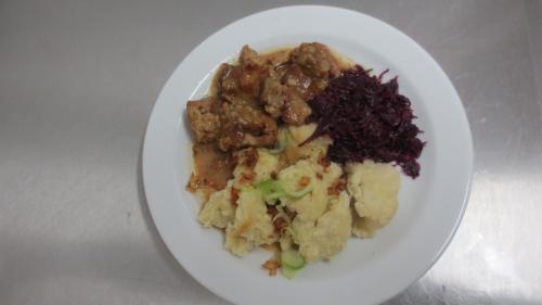 a plate of food on a white plate at Pension Jana - Wellness in Jilemnice