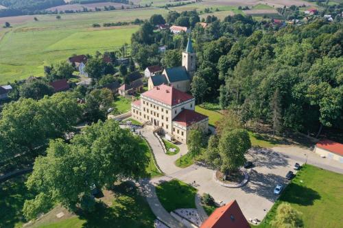 an aerial view of a large building with a tower at Pałac Lubiechowa-Jelenia Góra- Riesengebirge in Lubiechowa