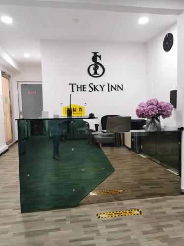 an office with a sign that reads the sky inn at The Sky Inn in Kuantan