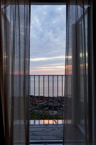a view of the ocean from a window at Nordlandet in Allinge